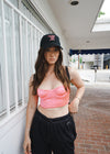Alisha Marie wearing the Don't need no man hat, with a pink top and black bottoms